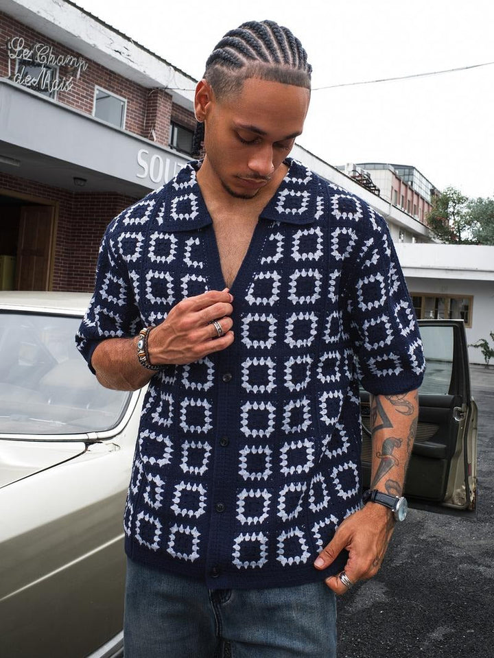 Men's short-sleeve textured knit shirt featuring subtle geometric pattern. Modern casual fashion.