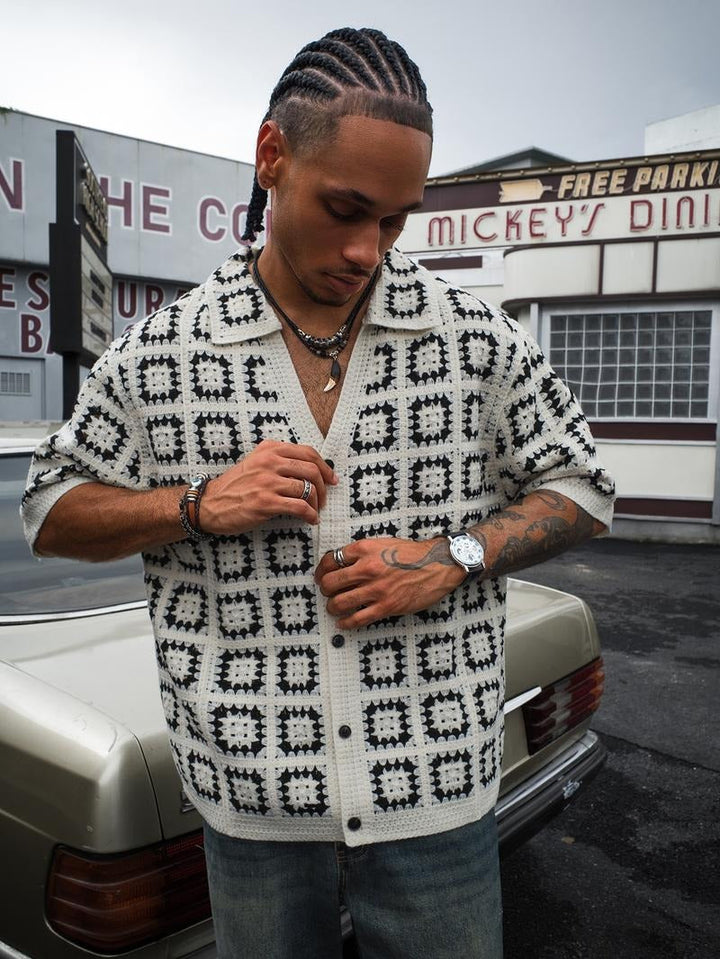 Men's textured short-sleeve knit shirt, geometric pattern detail, button-up. Versatile spring/summer.