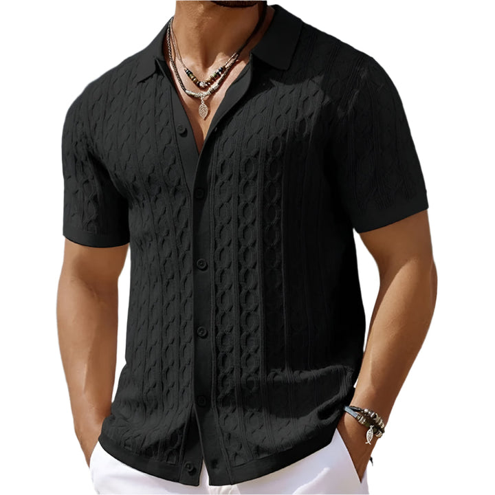 Close-up of the textured fabric and button-down collar detail on a men's short-sleeve smart casual polo shirt.