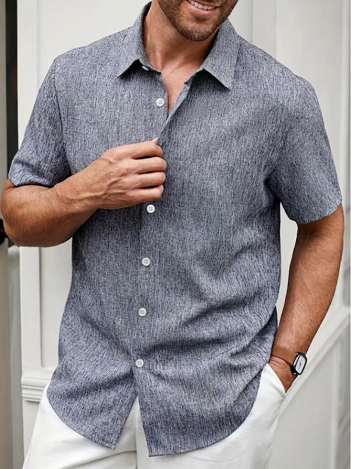Stylish men's textured polo shirt, regular fit. Perfect for casual wear, with a button-down collar & short sleeves.