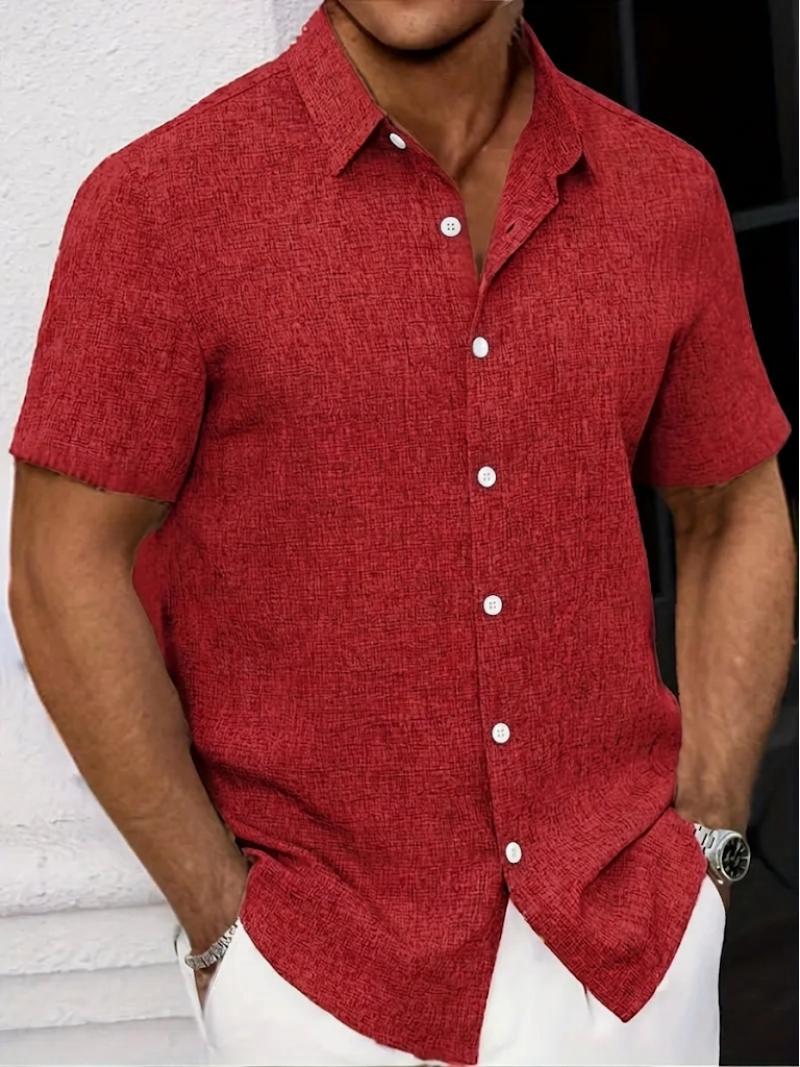 Smart casual men's polo shirt. Features a textured finish, button-down point collar, short sleeves, & regular fit.