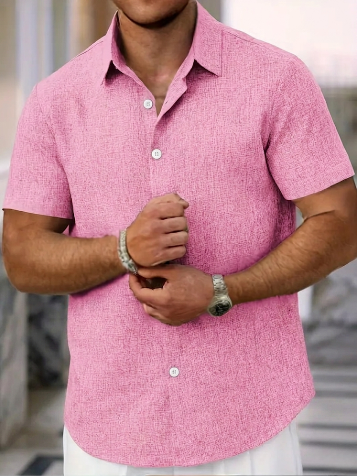 Everyday men's button-down polo with textured knit. Regular fit, short sleeve, & point collar for modern men's fashion.