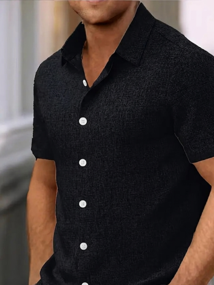 Modern men's textured short sleeve polo shirt. Button-down design, regular fit. Ideal for summer casual & smart looks.