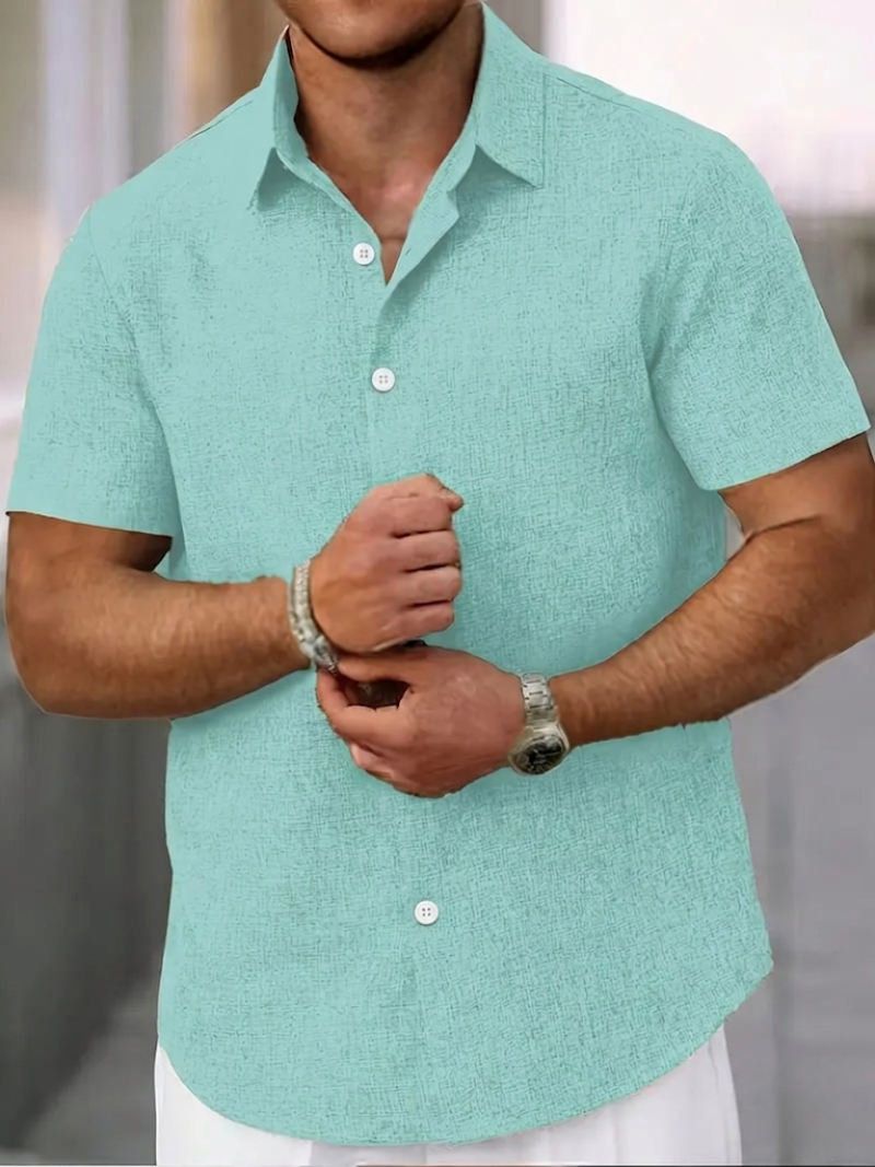 High-quality men's textured polo shirt. Regular fit, button-down closure, short sleeves. Essential for casual & smart style.