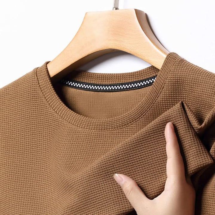 Soft men's lightweight textured t-shirt, a comfortable wardrobe essential for any casual occasion.