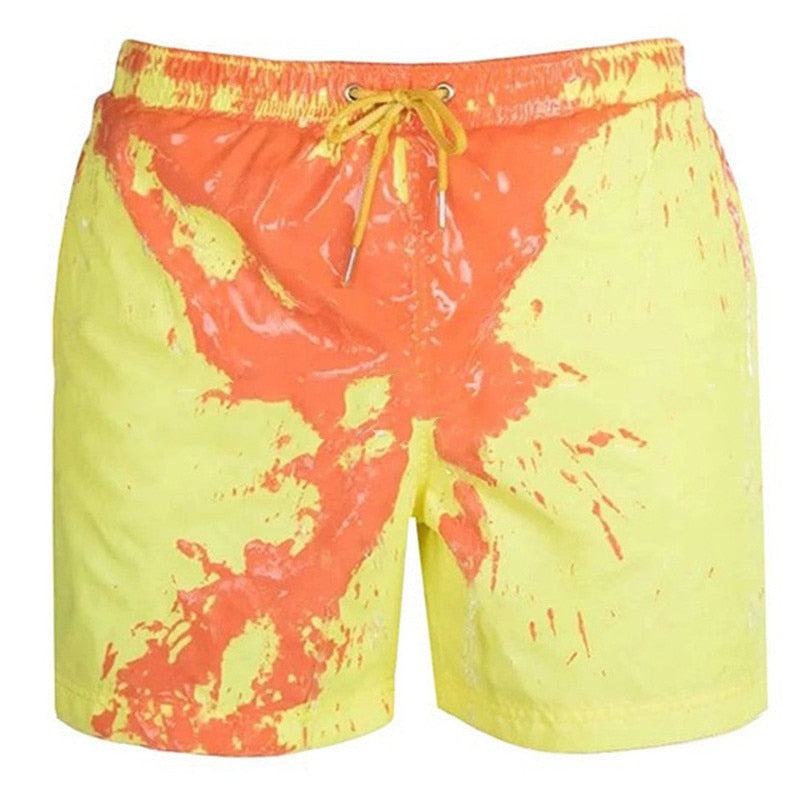Close-up of men's thermal swim shorts fabric with blue to red color change, ideal for summer fashion