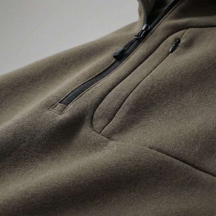 Close-up of men's thermal activewear jacket, half-zip design, perfect for cool weather training