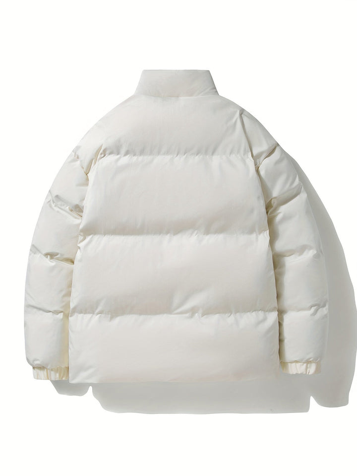 Warm men's quilted winter jacket, ideal for snowy conditions and outdoor adventures.