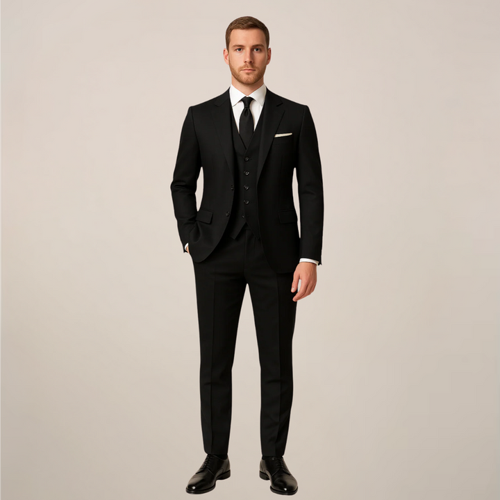 Elegant men's three-piece dinner suit with sharp contrast lapel. Ideal formal wear for weddings, prom, or black tie events.