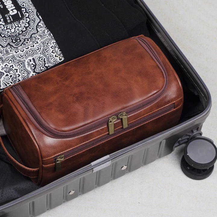 Compact men's dopp kit, ideal toiletry organizer for travel. Features a waterproof interior.