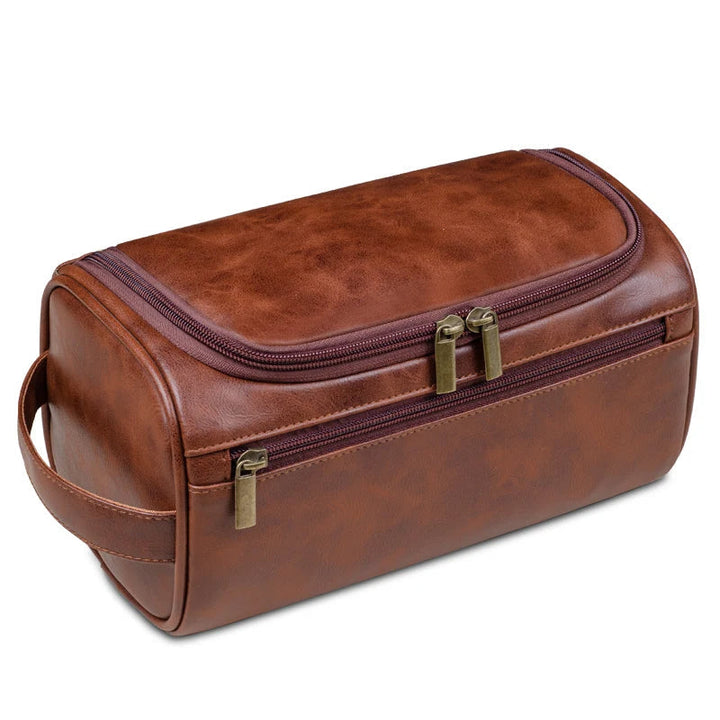 Organize men's grooming essentials with this travel toiletry bag. Features waterproof interior & compact design.