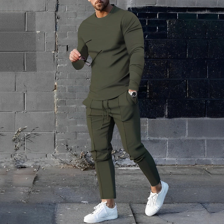Stylish men's activewear outfit: modern sweater & trendy joggers. Fashion-forward casual wear and matching set.