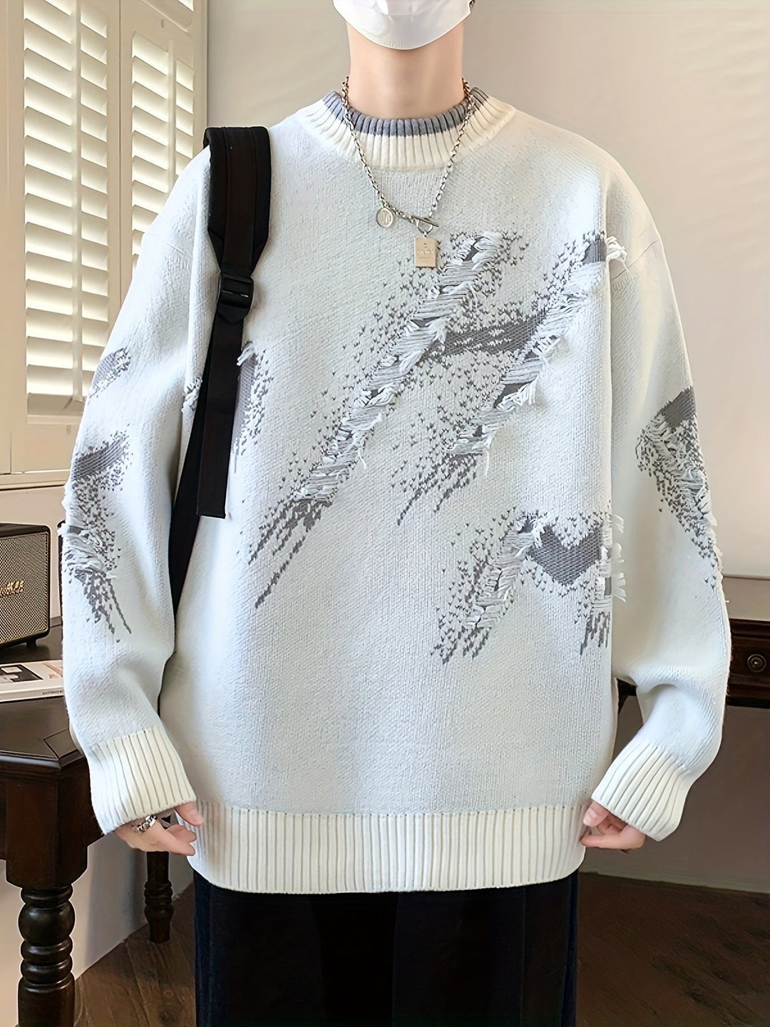 Stylish men's oversized color block sweater with unique frayed details. Ideal for modern autumn casual wear.