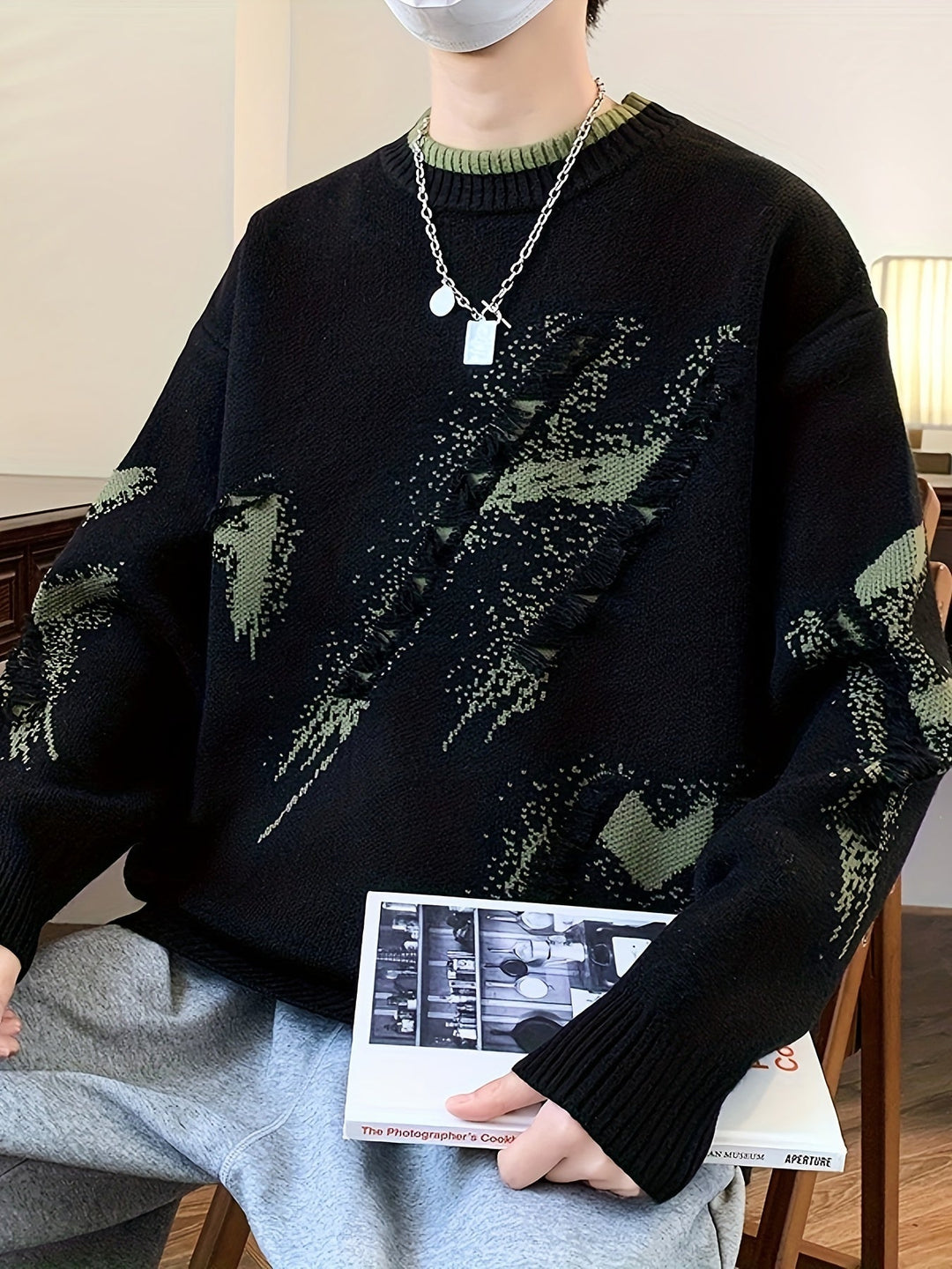 Modern men's oversized color block sweater with subtle frayed details. A trendy long-sleeve option for fall.