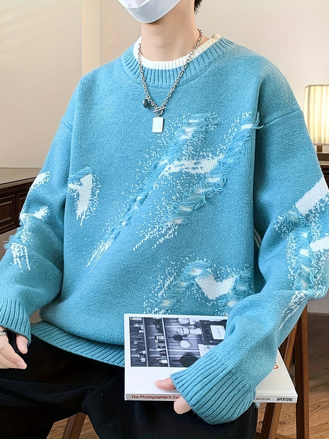 Men's trendy oversized sweater with stylish frayed edges. Perfect for a casual, relaxed look in winter.