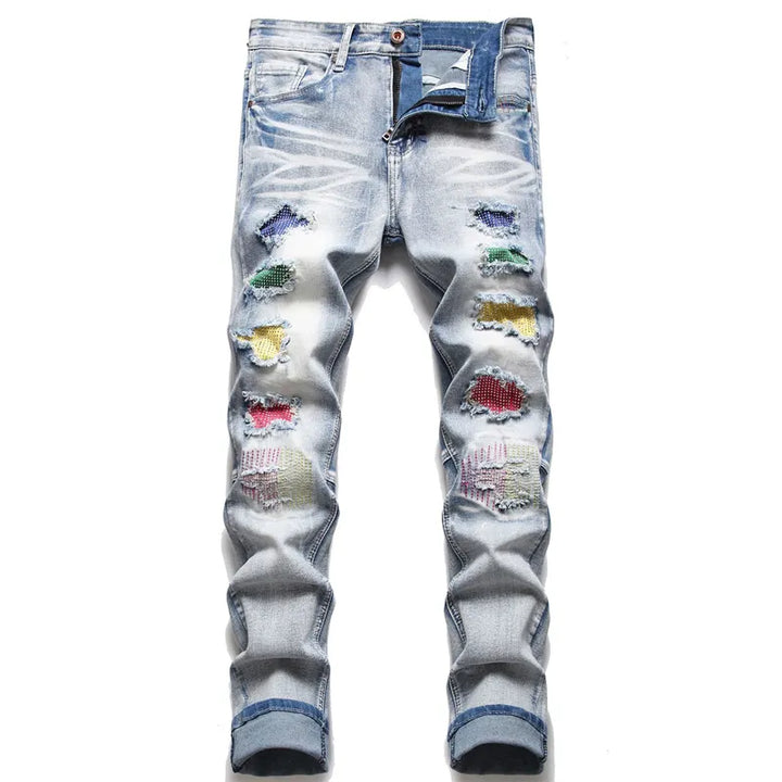 Men's trendy ripped jeans, modern fit distressed denim for a casual street style look.