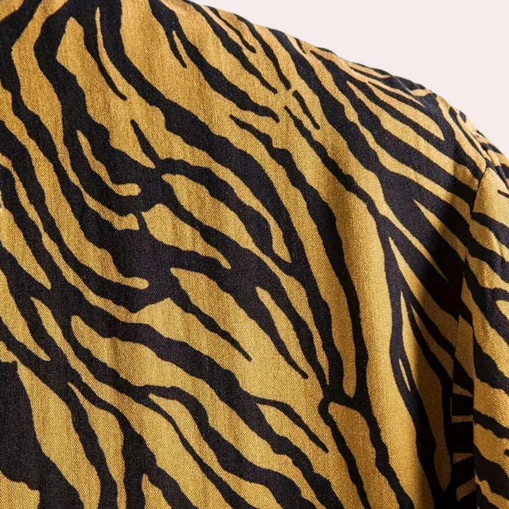 Men's casual tiger print button-up shirt. Trendy and bold style, a versatile statement piece for men's apparel.