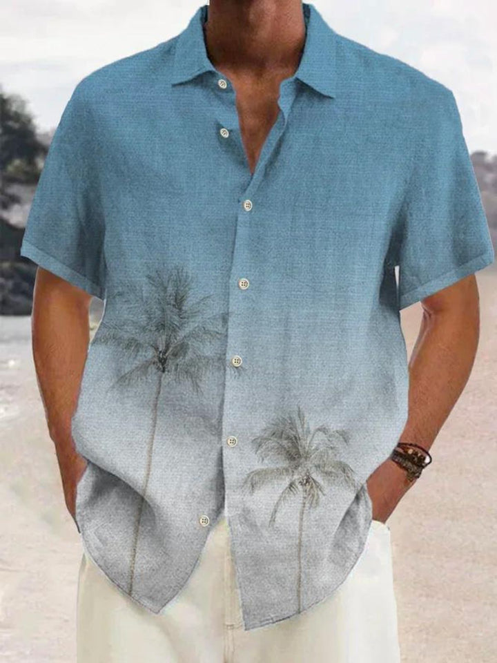 Relaxed fit men's tropical summer shirt, featuring a stylish coconut tree print. Ideal for vacation, beach, or casual wear.