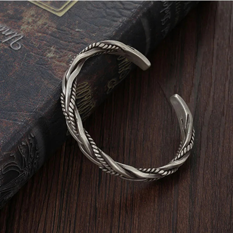 Modern men's twisted sterling silver cuff bracelet. This adjustable silver jewelry offers comfort and bold style.