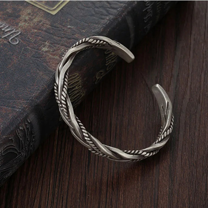 Modern men's twisted sterling silver cuff bracelet. This adjustable silver jewelry offers comfort and bold style.