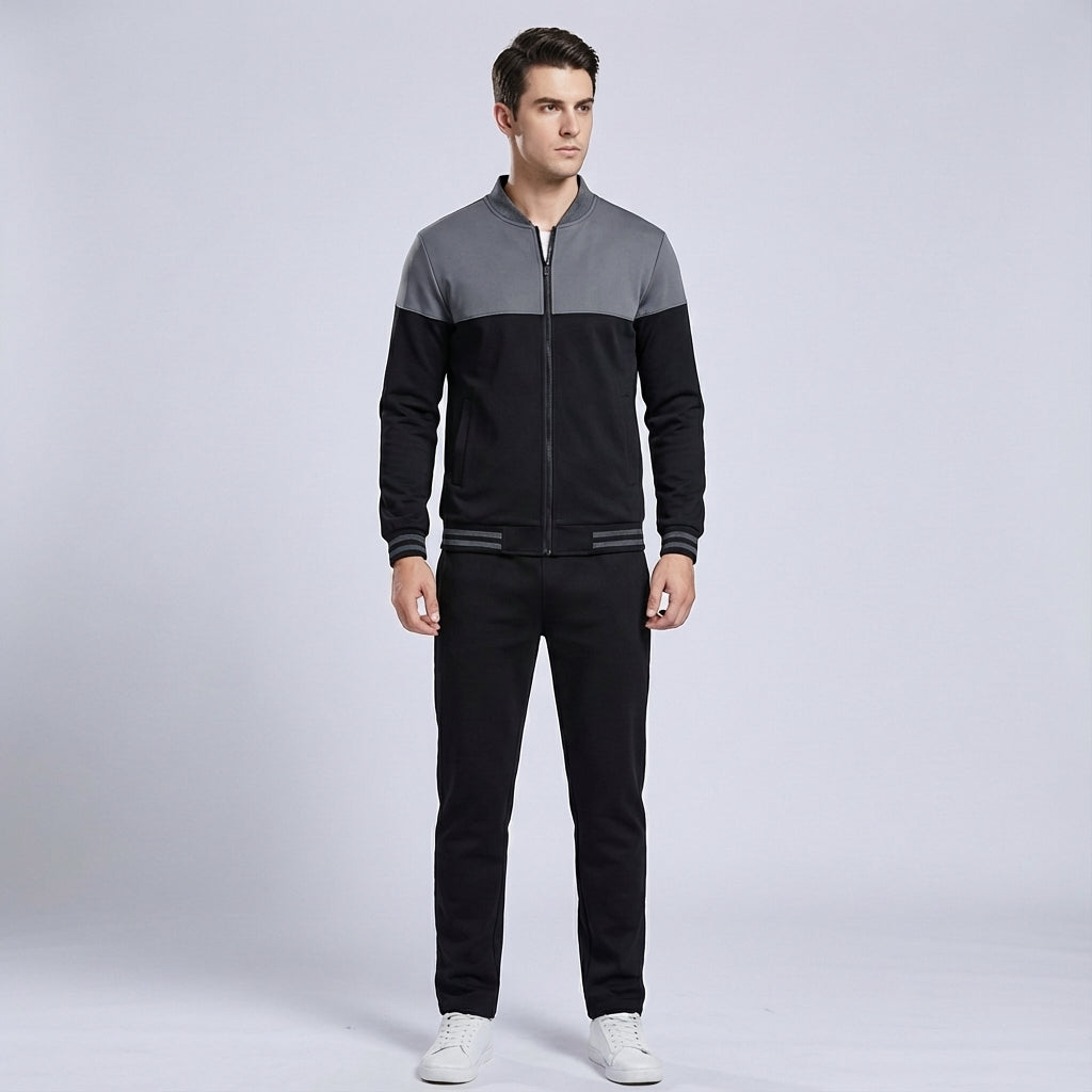 Gilbert men's tracksuit, side view, black and grey two-tone design perfect for athletic use
