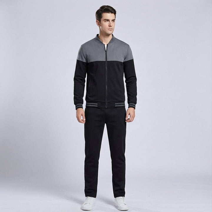 Gilbert men's tracksuit, side view, black and grey two-tone design perfect for athletic use