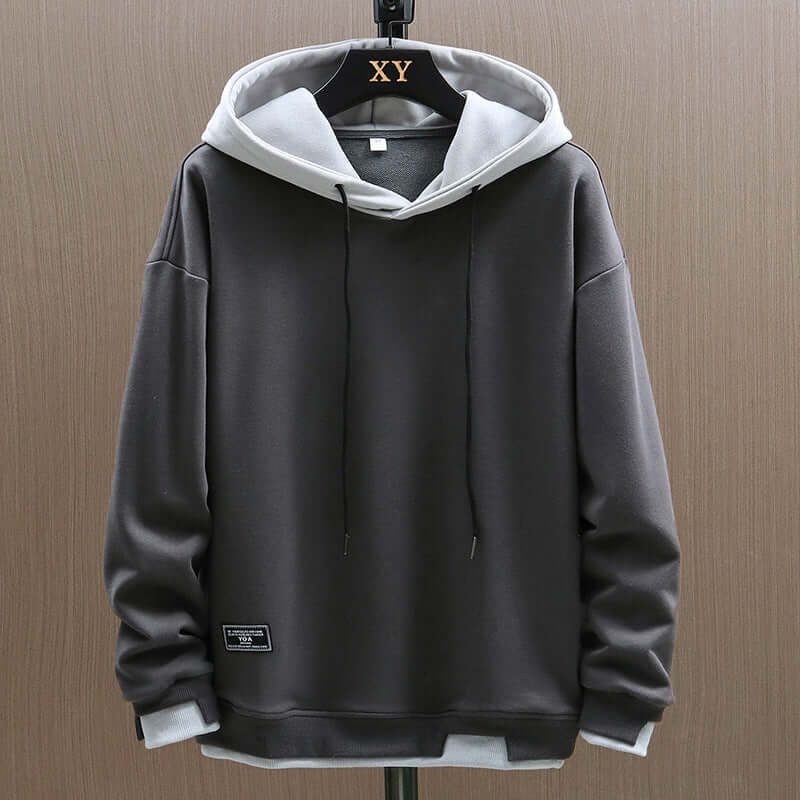 Comfortable men's two-tone colorblock pullover hoodie with a relaxed fit for modern casual style.