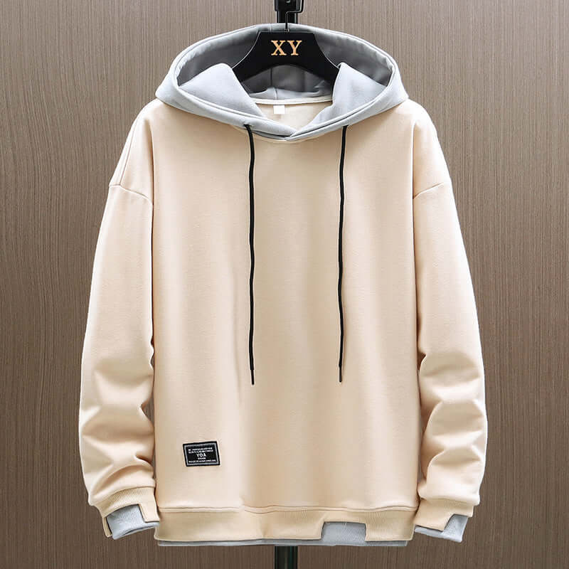 Stylish men's two-tone colorblock hoodie, a comfortable pullover top ideal for modern streetwear.