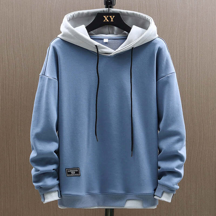 Casual men's two-tone colorblock hoodie, a soft, relaxed-fit pullover for everyday comfort.