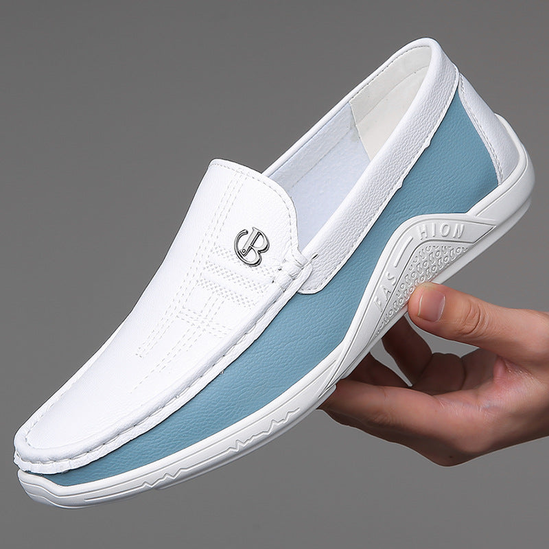 Men's two-tone slip-on loafers worn with tailored trousers, demonstrating versatile styling.