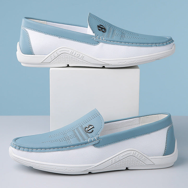 Stylish men's two-tone slip-on loafers, a must-have for modern men's fashion trends.