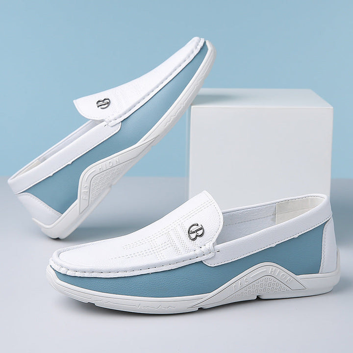 Stylish men's two-tone loafers with a slip-on design, perfect for casual or dressy looks.