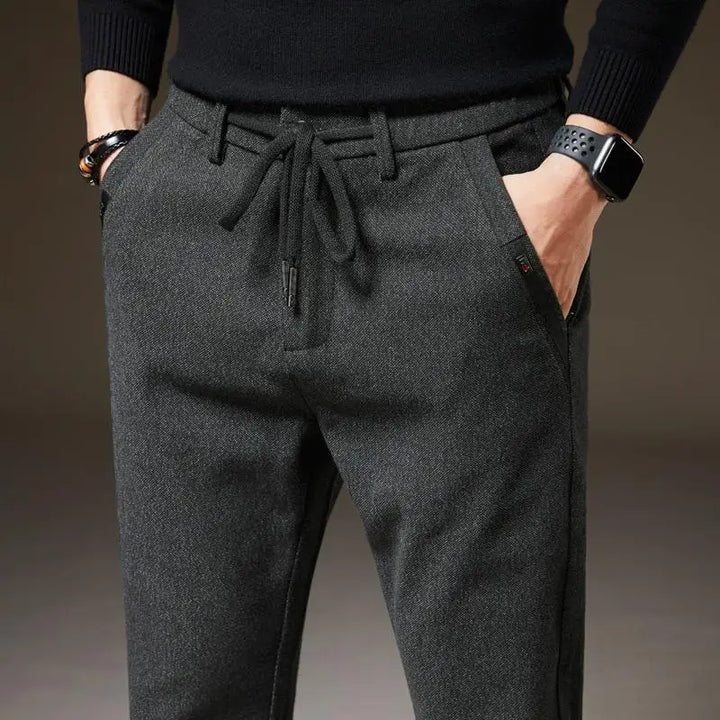 Versatile men's slim fit casual pants. Comfortable drawstring design for everyday wear & modern fashion.