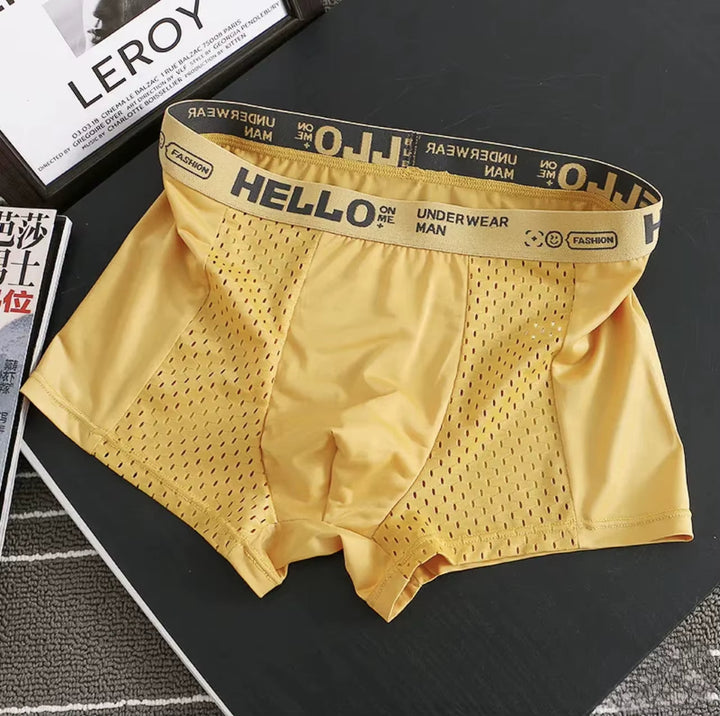 Close-up of men's breathable mesh boxer briefs fabric, showing stretch & quick-dry texture.
