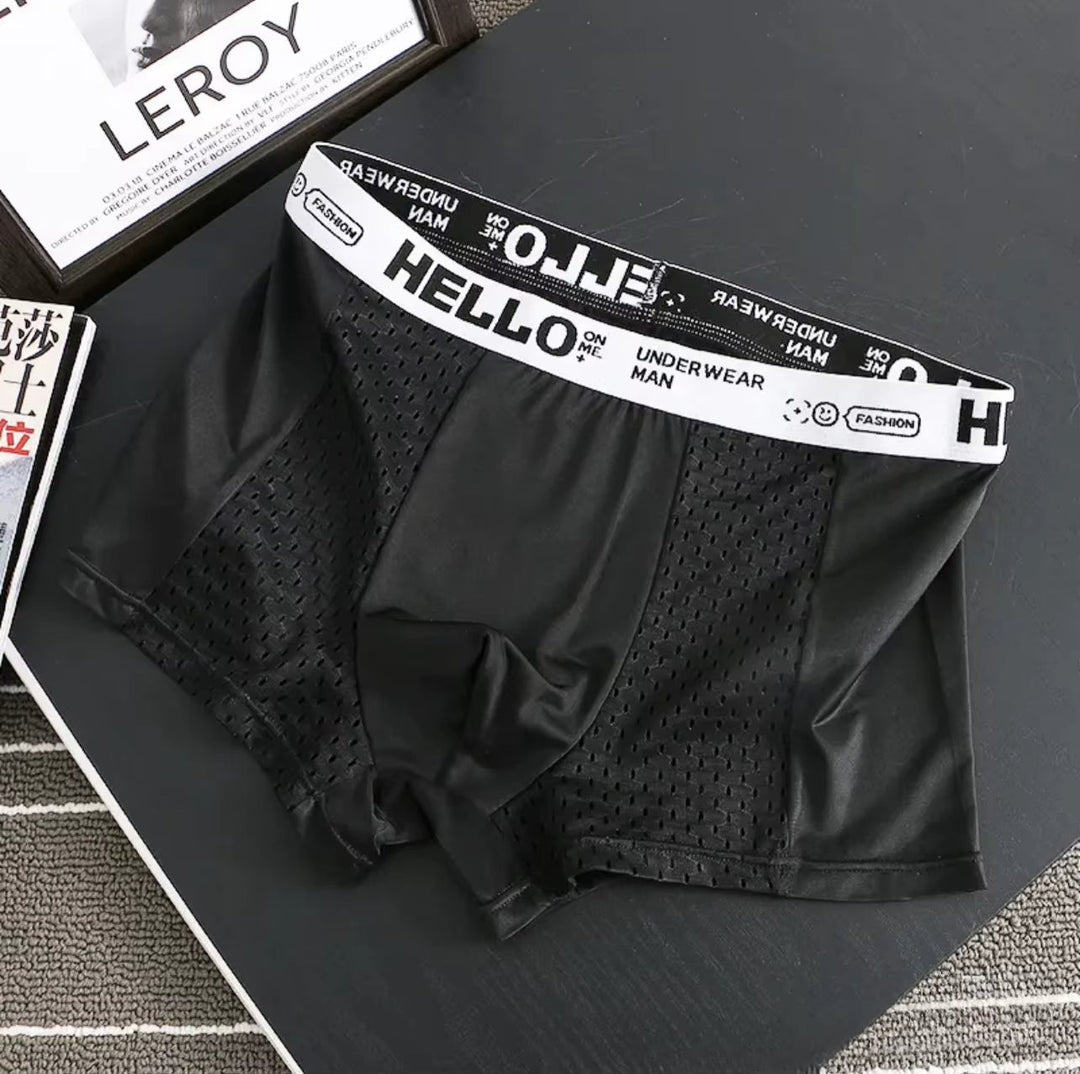 Ergonomic men's breathable mesh boxer briefs, designed for athletic support & all-day comfort.