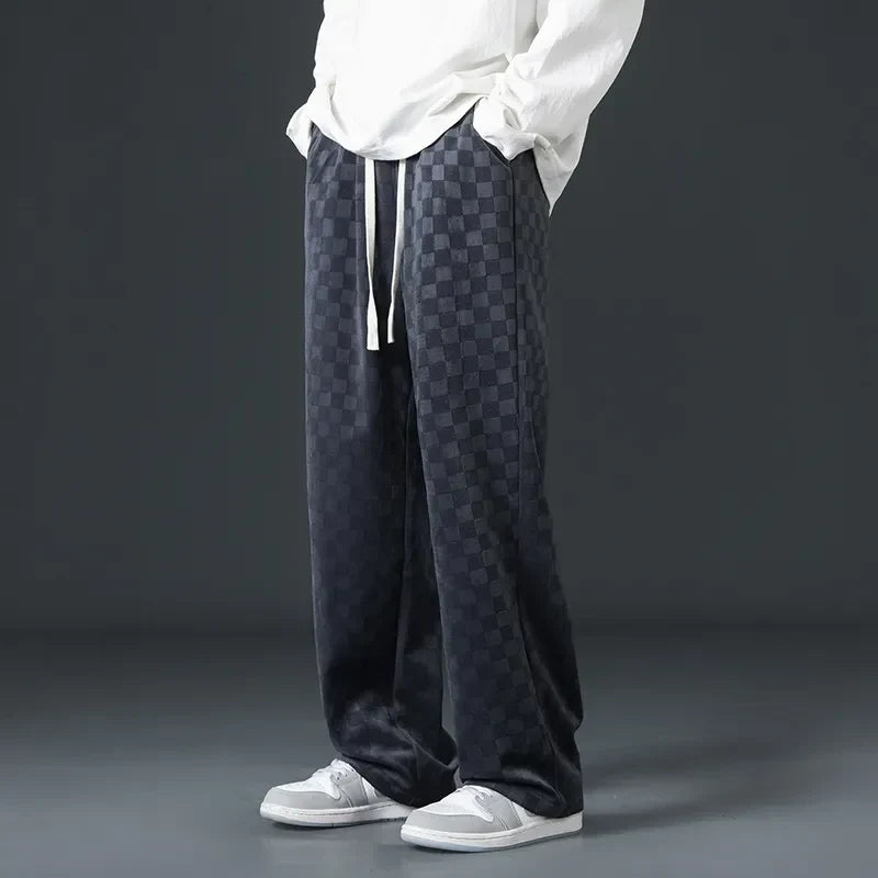 Men's essential black relaxed fit athletic pants, providing ultimate comfort for workouts or daily errands.