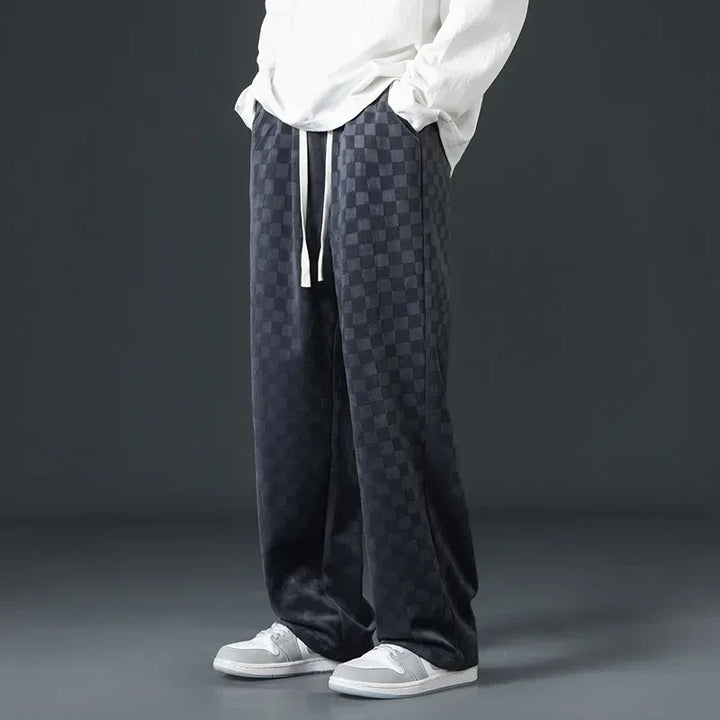 Men's essential black relaxed fit athletic pants, providing ultimate comfort for workouts or daily errands.