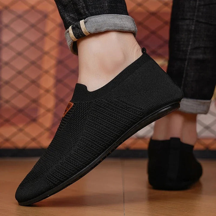 Lightweight men's slip-on sneakers with breathable AirKnit upper for ultimate comfort.
