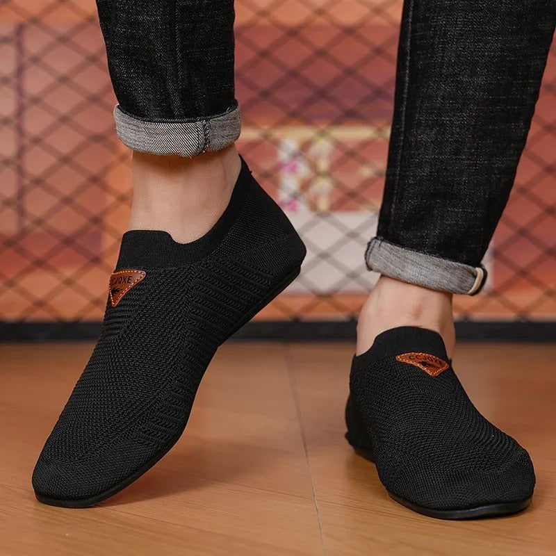 Breathable knit men's slip-on shoes, designed for lightweight comfort & everyday wear.