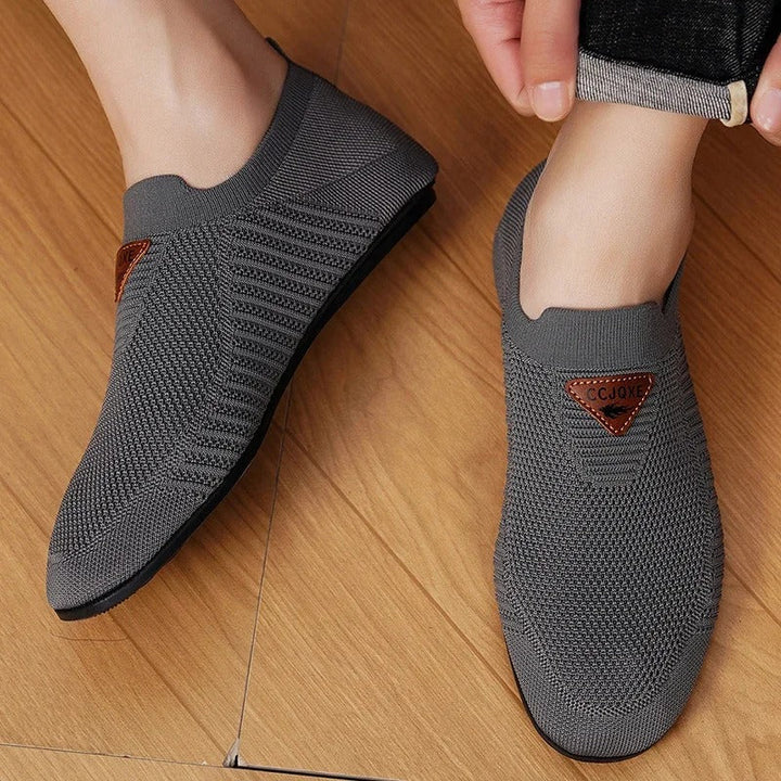 Easy-wear men's AirKnit slip-on shoes, providing breathable comfort for active lifestyles.