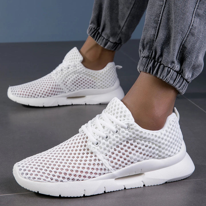 Lightweight men's black athletic running shoes with breathable mesh upper, offering comfort & support.