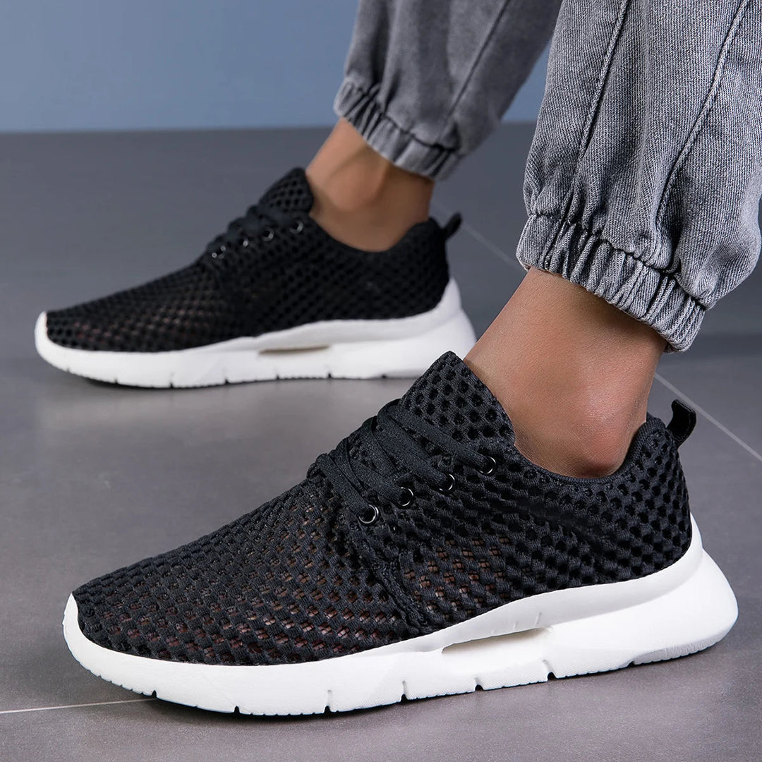 Comfortable men's white athletic sneakers with cushioned sole, lightweight for long walks & daily runs.