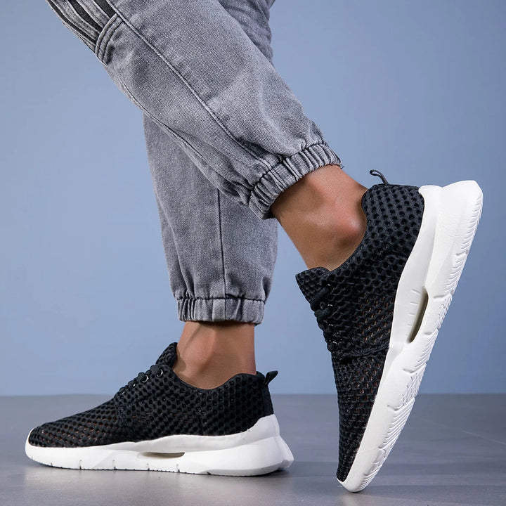 Modern men's breathable athletic footwear, ultra-light design enhances performance, perfect for active lifestyle.