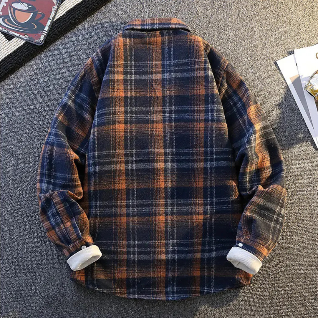 Close-up of the ultra-soft fabric on a men's fall fashion plaid button-down shirt.
