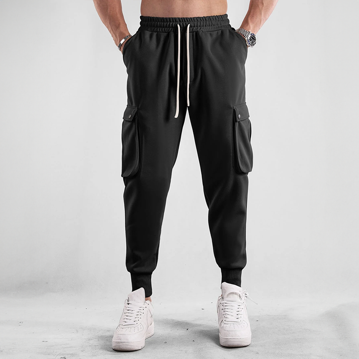 Close-up of men's cargo jogger fabric, highlighting the stretch and durable French Terry material.