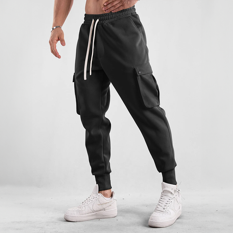 Man walking in comfortable Men's Urban Flex Cargo Joggers, showcasing flexible movement and casual style.