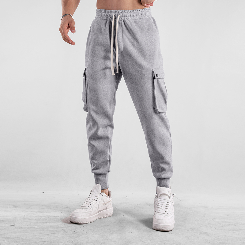 Detailed view of men's cargo jogger pocket, secure storage on soft, flexible stretch pants.