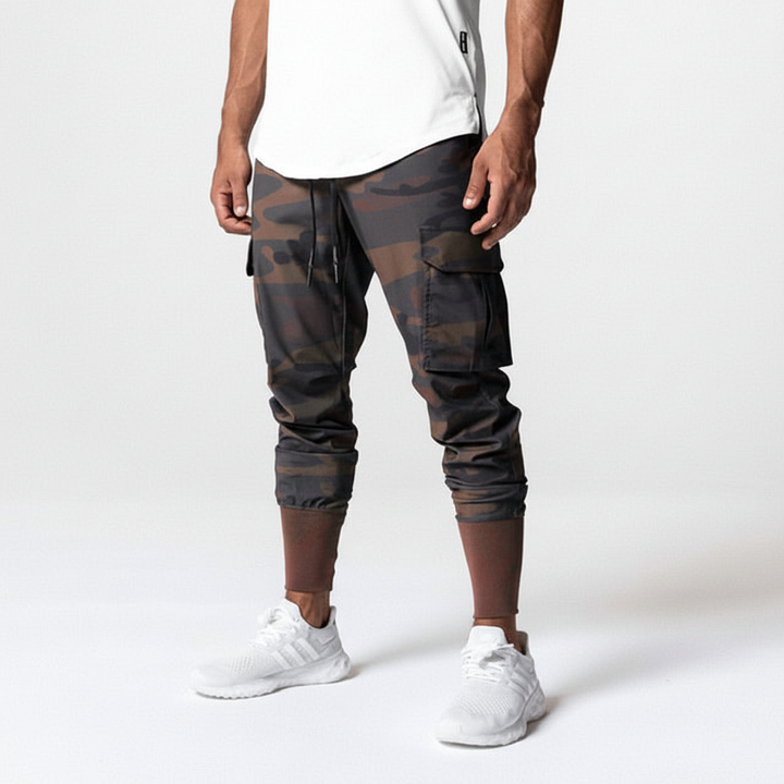 Men's urban performance cargo joggers, stretch fabric, multi-pocket design, comfort fit activewear.