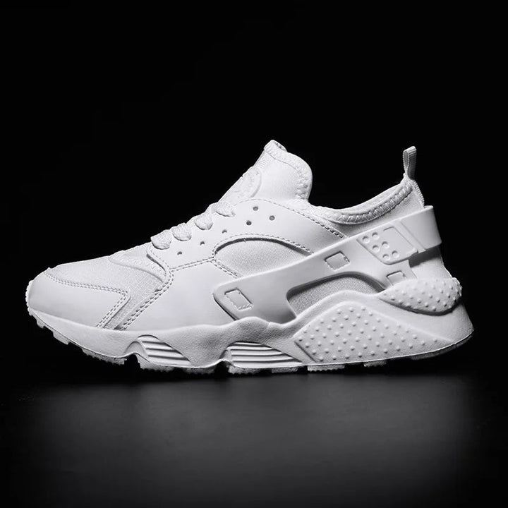 Close-up of men's urban street sneakers, highlighting breathable fabric and sturdy durable construction.