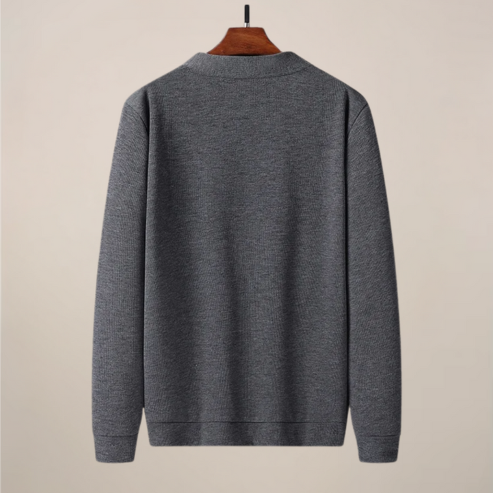 Stylish men's V-neck cardigan sweater with practical front pockets, perfect for casual or smart-casual layering.